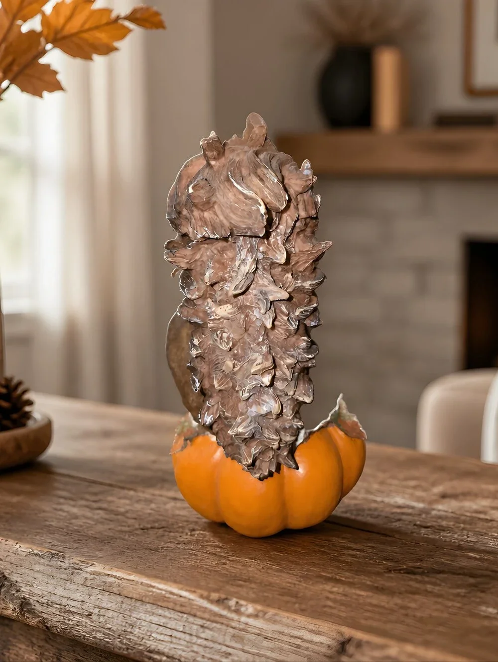vintage resin autumn squirrel figurine perched atop a pumpkin Holdinging Nuts